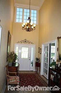 Soaring foyer with beautiful chandelier