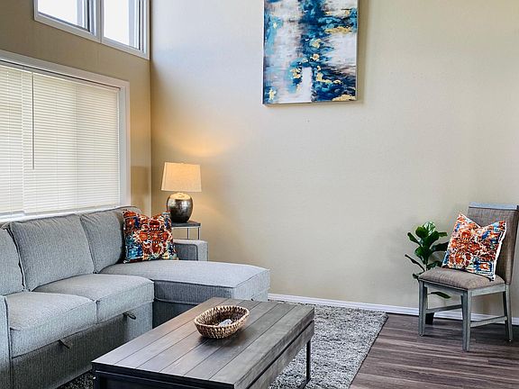 Lots of light in this beautiful unit! Vaulted ceiling, luxury plank floor, fresh paint.