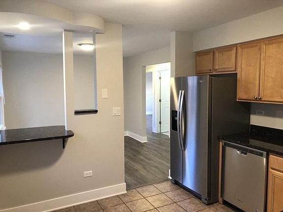 Partial kitchen view with dining room