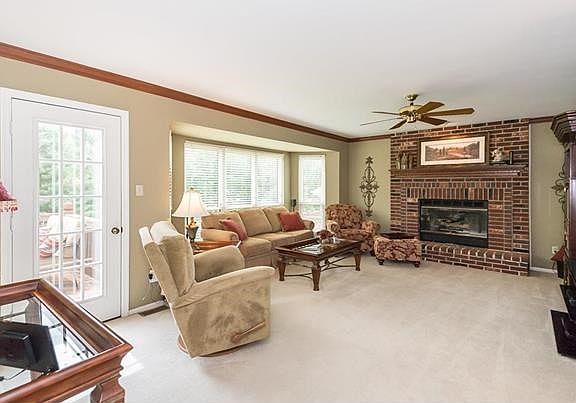 Family room has a beautiful floor to ceiling brick gas fireplace, 5 bay window as well as crown molding.