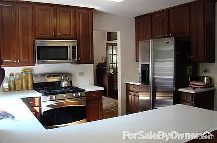 Kitchen
						:
						New w/ 42" cherry cabinets, stainless steel appl's, corian countertops