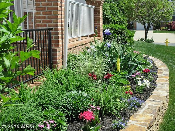 Lovely Gardens Surrounding Porch