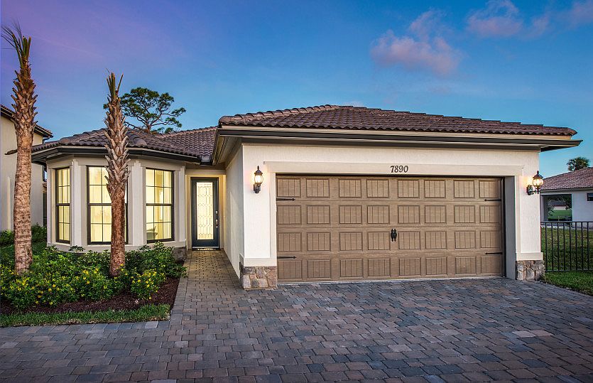 The Wyndham, a one-story family home with a 2 car garage, shown with Home Exterior FM2B