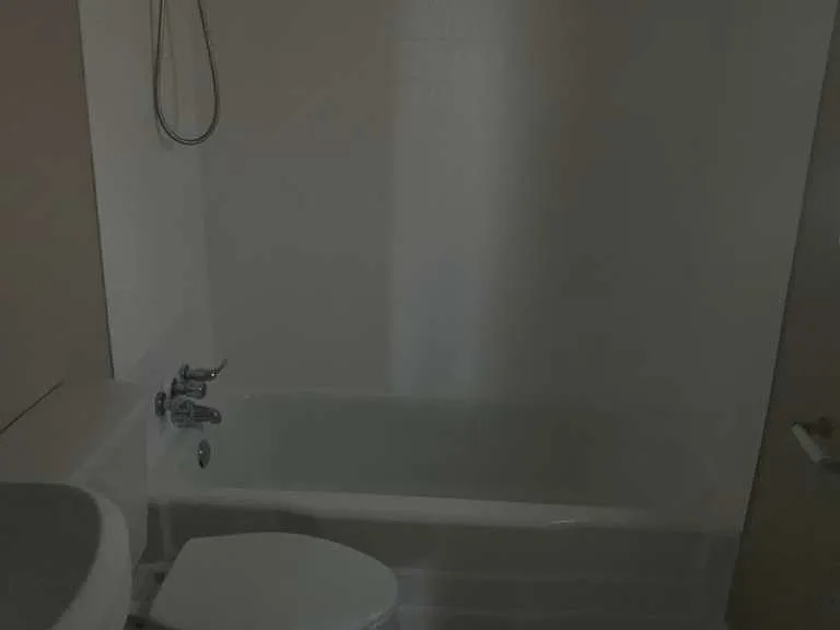 bathroom with tub and shower