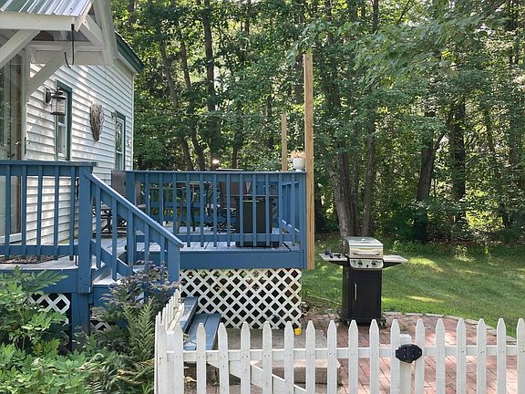 Beautiful hardscaping, gardens, picket fence and deck