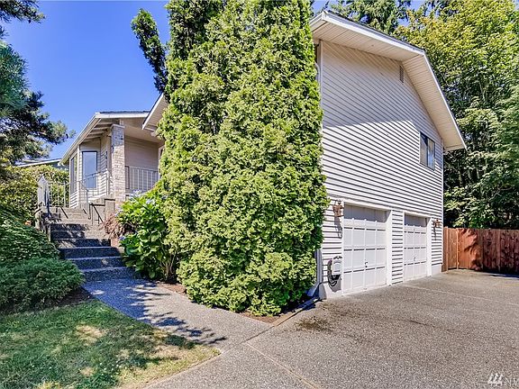 Large driveway and spacious two car garage.