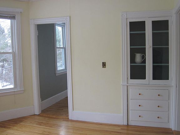 dining room with view of china cabinet and door to pantry