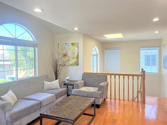 Living room area looking back at staircase which is the entrance to the unit
