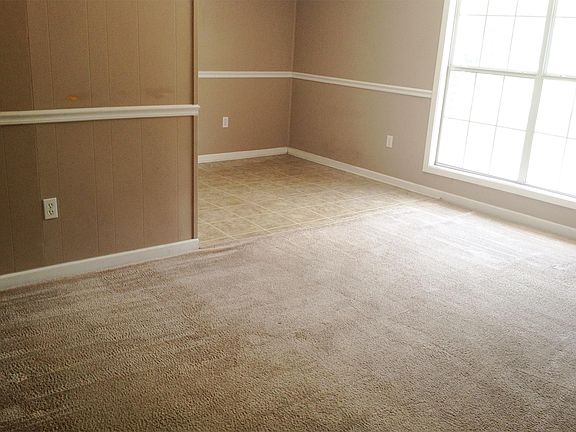 Living room with a view of the dining area.