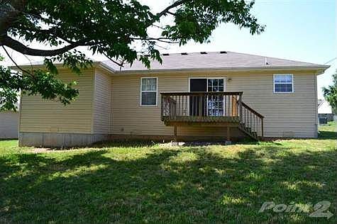 Beautiful rear view of this virtually maintenance free exterior home.