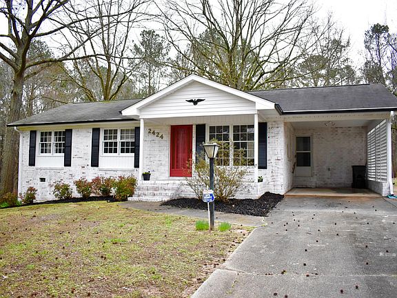 Front view of home, freshly painted with vibrant red door!