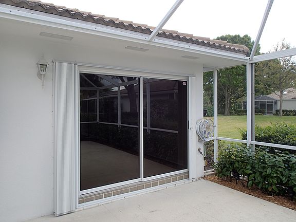 Accordion hurricane shutters