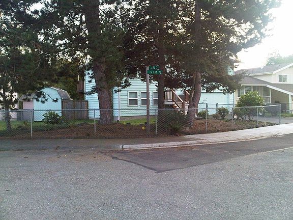 Looking through the trees on the front of the property.