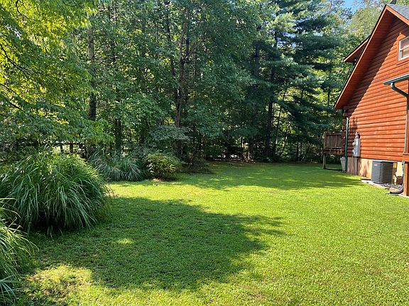 Side yard is flat and great place for horseshoes or cornhole.