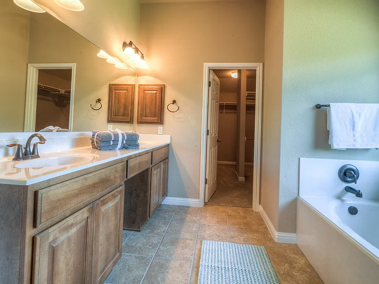 Primary bathroom has double vanity, garden tub, and separate shower. The closet is amazing, it is a huge walk-in