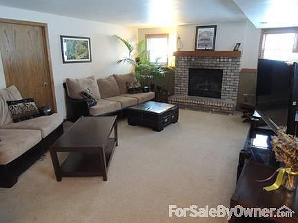 Living Room
						:
						Spacious Living Area with Wood-Burning Fireplace