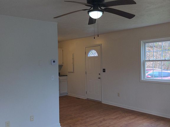 View through the front entrance, looking towards the kitchen and side door
