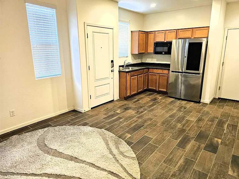 Kitchen with newer fridge, convection microwave