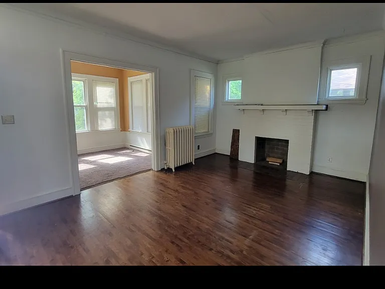 View of dining room from living room. (Fireplace is not functioning)