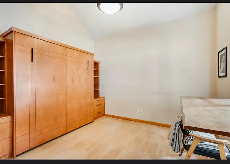 4th room which has a built in king size murphy bed and large vaulted ceilings