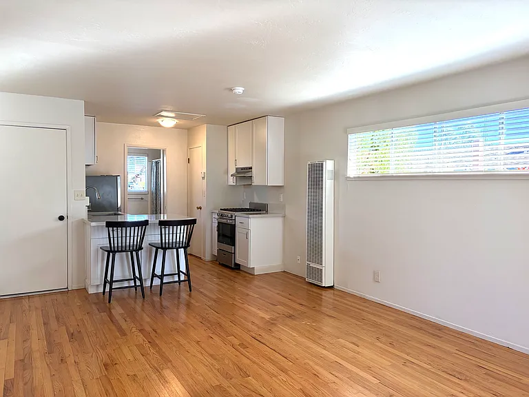 Another view with wall heater and window