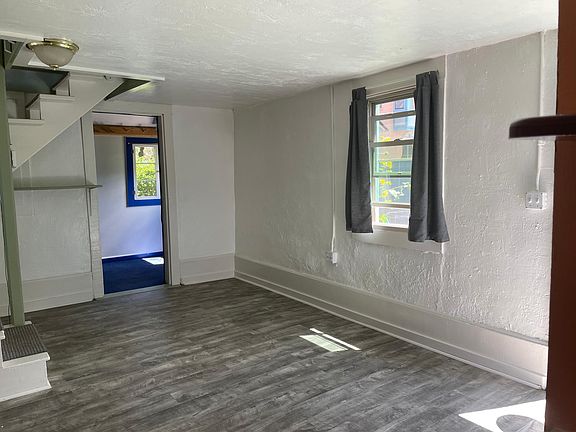 Living room area w additional room off to the east.