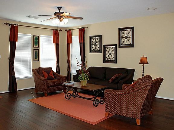 The living room looks out onto the backyard and is open to the kitchen.