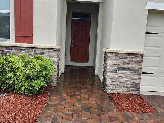 fresh red mulch in garden areas / front entrance to house
