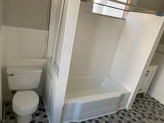 The full bathroom.The laundry closet is across from the vanity sink