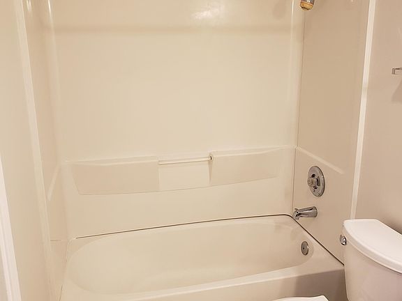 Master bath toilet and tub
