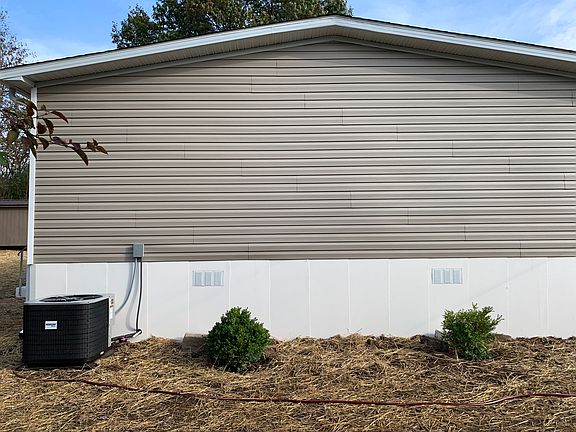 Side of home and New unit