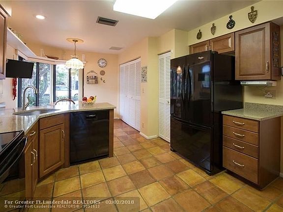 Remodeled kitchen features LG Viatera natural quartz counter tops