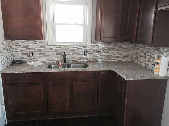 New Kitchen with granite, cabinets and wooden floor
