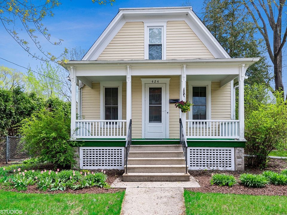 Adorable front porch to this home! The landscaping and curb appeal are fantastic!