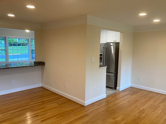 Dining room with view of bar seating area and side of kitchen.