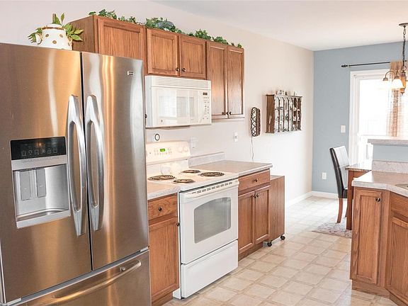 Tons of cabinets and countertop space with large pantry