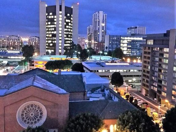 Evening View -- The City Hall building and old courthouse are gone now, replaced by the new civic center. The image will be updated when I receive them!