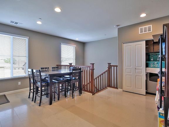 Dining Room & Washer/Dryer Unit (Right)
