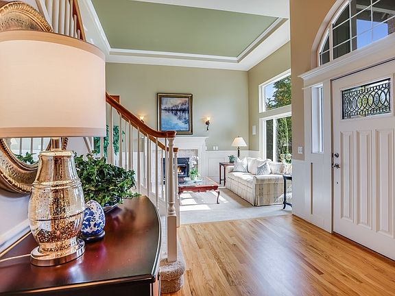 Enter to an open cathedral ceiling and recently refinished hardwood floors.>