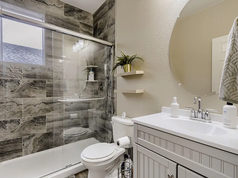 Downstairs full bath with a newly added shower allows you the option to have use the study room as additional guest space!