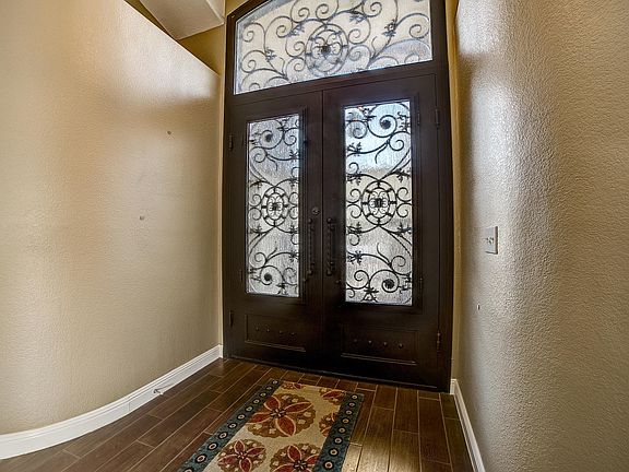 Custom wrought iron door with screens