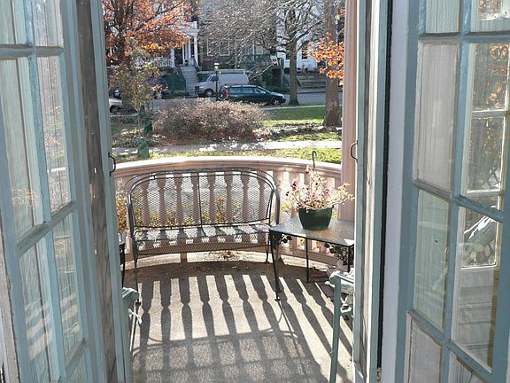 View of balcony and Meadow Park from living room