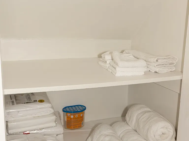 Lots of cabinet space in bathroom for accessories.