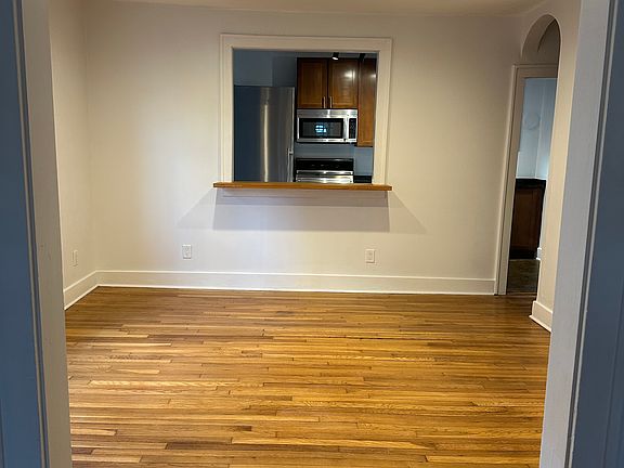 View from living room into dining room also into kitchen