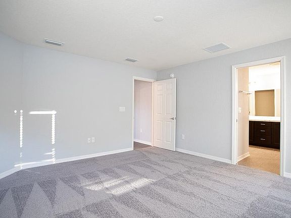Owner s suite with en-suite bath - Photo showcases a home with similar finishes. Colors and design o