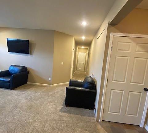 Door to right is locked to unit above.. Hallway to the 2 bedrooms, bathroom and storage area