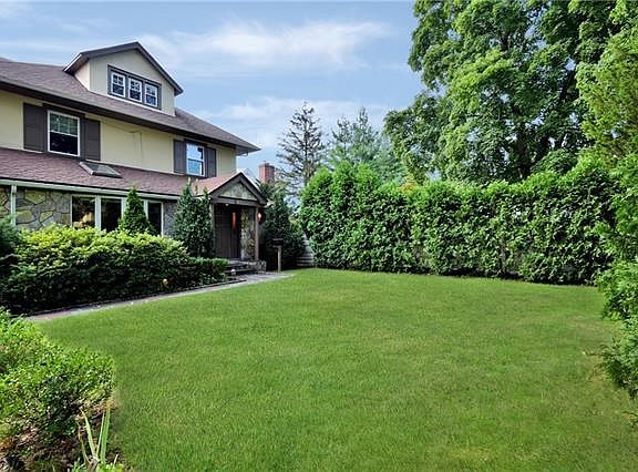 Front Yard with large shrubs offers privacy from the street.