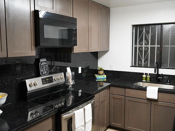 New stainless steel stove, built in microwave and hood.