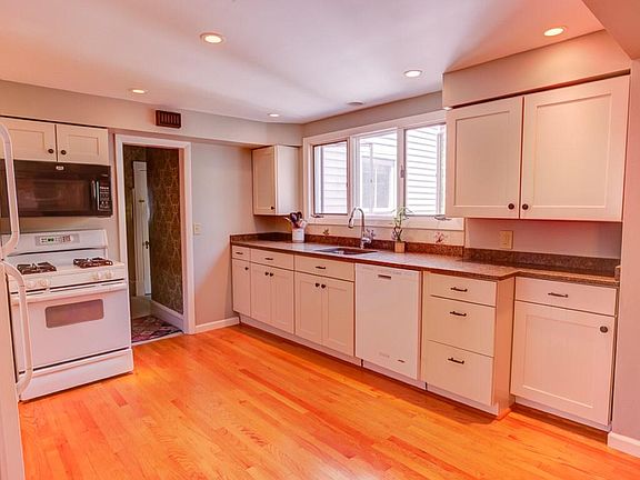 Remodeled Kitchen with modern appliances and first floor lau
