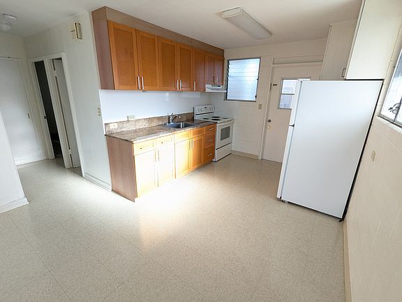 Kitchen area and hallway (residents commonly place a dining table next to refrigerator)